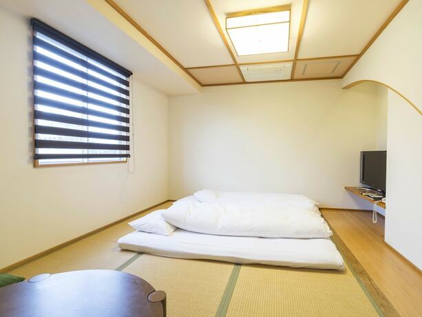 Imagen de la habitación del Hotel Minatoya. Foto 21