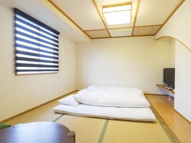 Imagen de la habitación del Hotel Minatoya. Foto 24