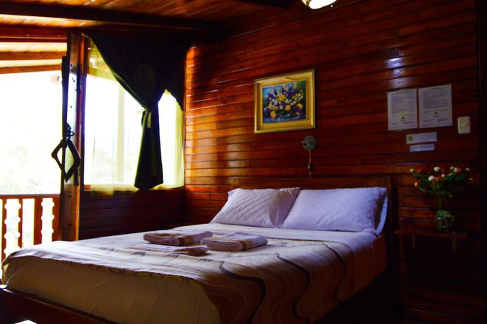 Imagen de la habitación del Hotel Mindo Green House. Foto 8