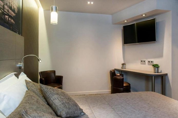 Imagen de la habitación del Hotel Minerve Paris. Foto 8
