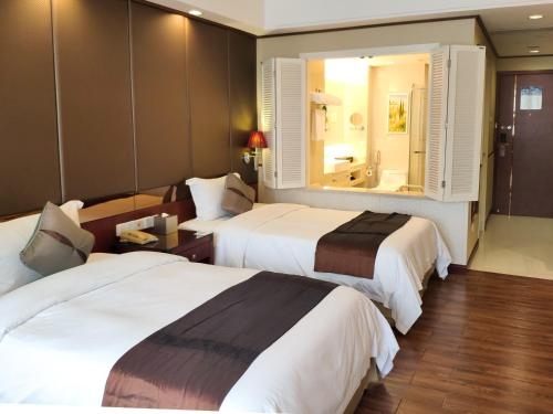 Imagen de la habitación del Hotel Ming Guang International Grand Hotel Haikou. Foto 8
