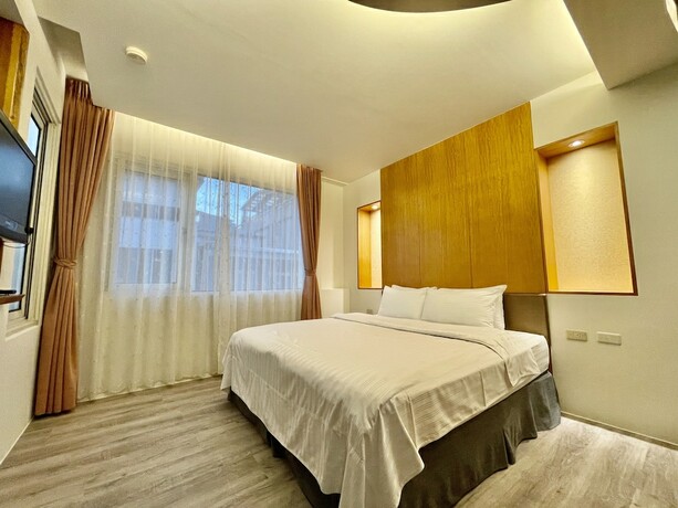 Imagen de la habitación del Hotel Ming Hu Bandb (no Elevator). Foto 7