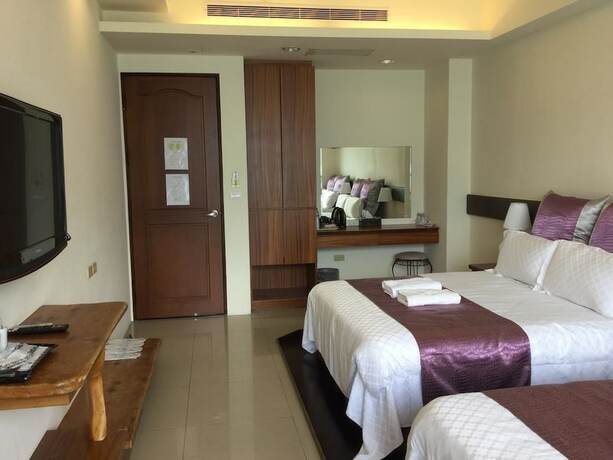 Imagen de la habitación del Hotel Ming Hu Bandb (no Elevator). Foto 15