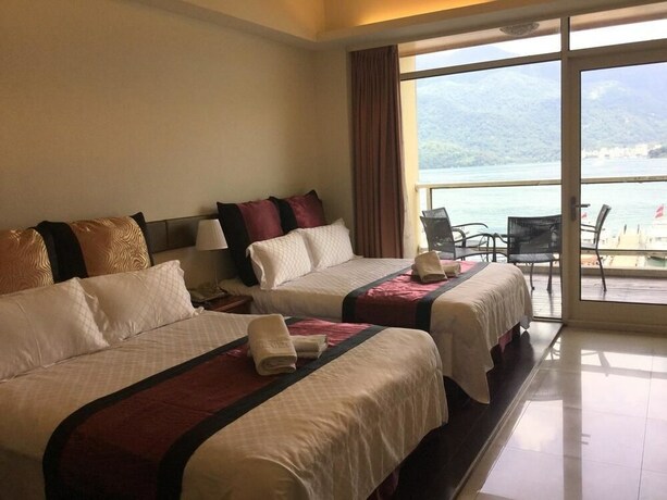 Imagen de la habitación del Hotel Ming Hu Bandb (no Elevator). Foto 21