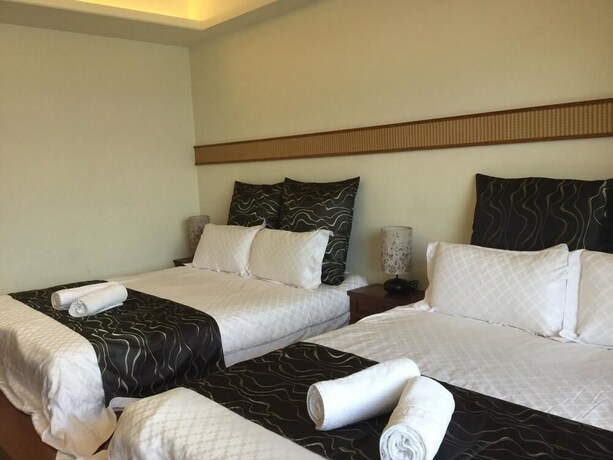 Imagen de la habitación del Hotel Ming Hu Bandb (no Elevator). Foto 25