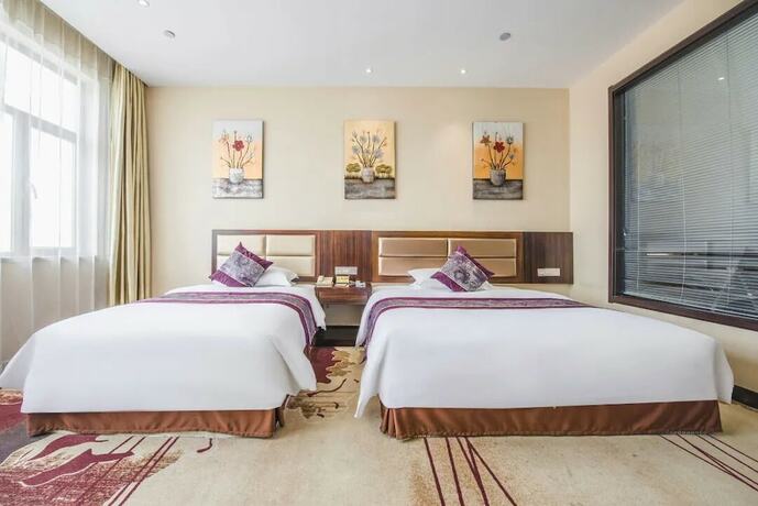 Imagen de la habitación del Hotel Ming Hua. Foto 10