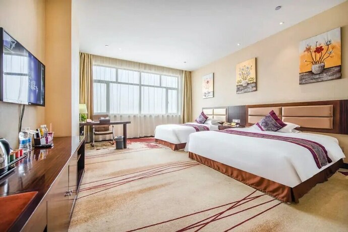 Imagen de la habitación del Hotel Ming Hua. Foto 11