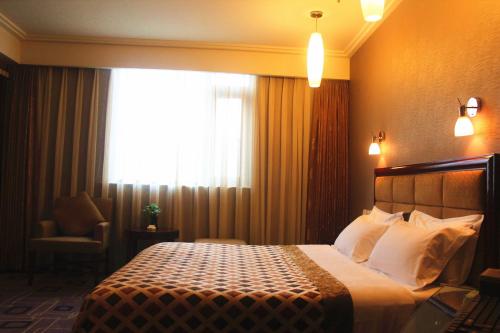 Imagen de la habitación del Hotel Ming Ren Grand Hotel. Foto 7