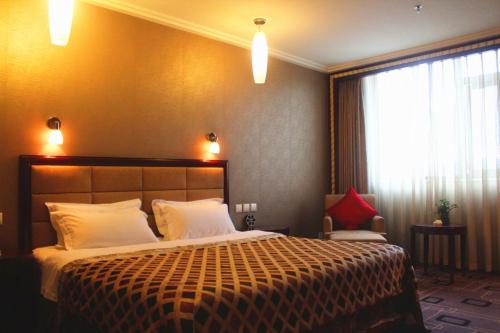 Imagen de la habitación del Hotel Ming Ren Grand Hotel. Foto 8