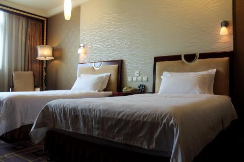 Imagen de la habitación del Hotel Ming Ren Grand Hotel. Foto 9