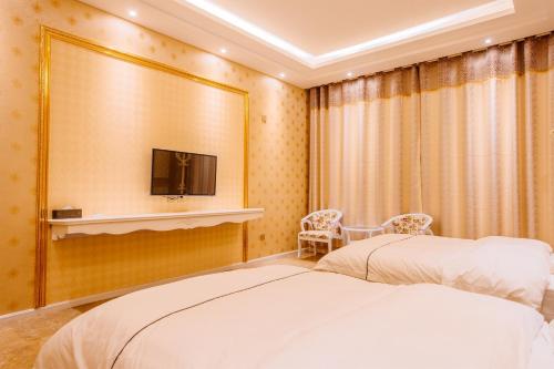 Imagen de la habitación del Hotel Mingdu Hotel. Foto 8