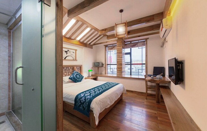 Imagen de la habitación del Hotel Minguo Life Zhangjiajie. Foto 18