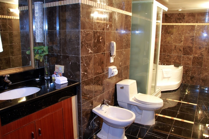 Imagen de la habitación del Hotel Mingyuan. Foto 13
