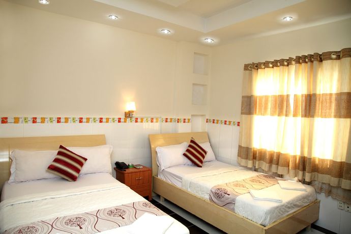 Imagen de la habitación del Hotel Minh Quang, Ho Chi Minh. Foto 11