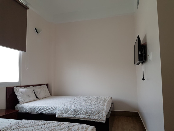 Imagen de la habitación del Hotel Minh Trang Motel. Foto 12