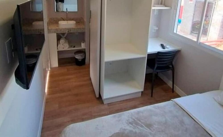 Imagen de la habitación del Hotel Mini House Lago Santa. Foto 15