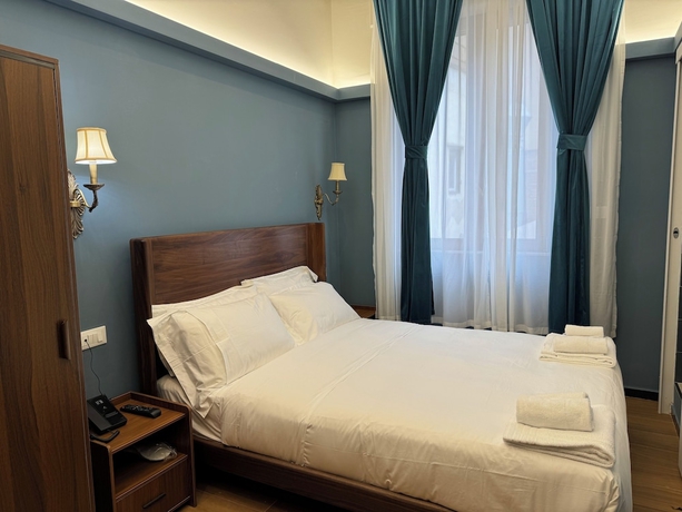 Imagen de la habitación del Hotel Mini, Livorno. Foto 2