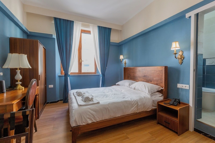 Imagen de la habitación del Hotel Mini, Livorno. Foto 5