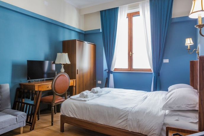 Imagen de la habitación del Hotel Mini, Livorno. Foto 8