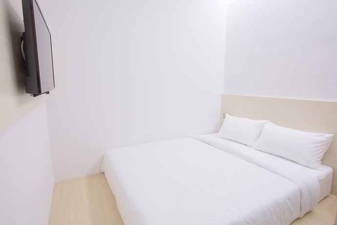 Imagen de la habitación del Hotel Minimalist. Foto 15