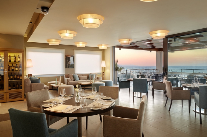 Imagen del bar/restaurante del Hotel Minoa Palace Resort and Spa. Foto 8