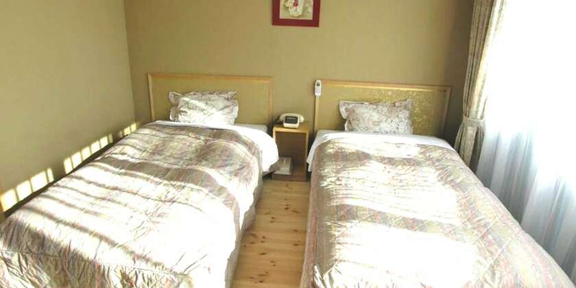 Imagen de la habitación del Hotel Minshuku Inn Shirahama Ekinoyado. Foto 16