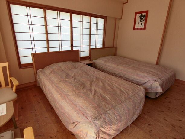 Imagen de la habitación del Hotel Minshuku Inn Shirahama Ekinoyado. Foto 24