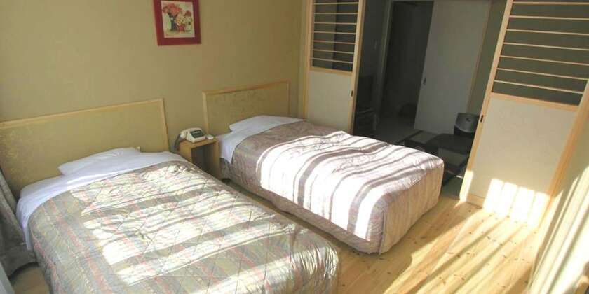 Imagen de la habitación del Hotel Minshuku Inn Shirahama Ekinoyado. Foto 31