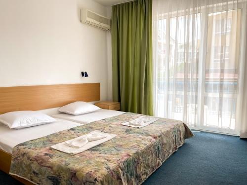 Imagen de la habitación del Hotel Mint Family Hotel. Foto 13