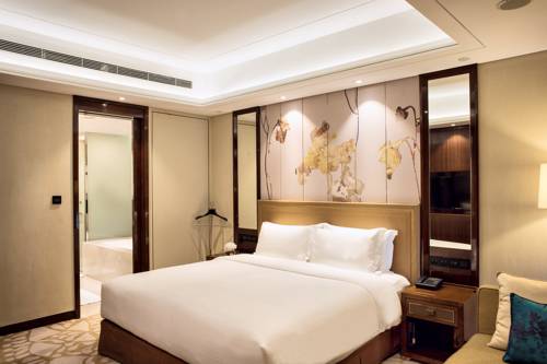 Imagen de la habitación del Hotel Minyoun Chengdu Dongda. Foto 12