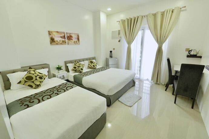 Imagen de la habitación del Hotel Mirage Suites De Boracay. Foto 11