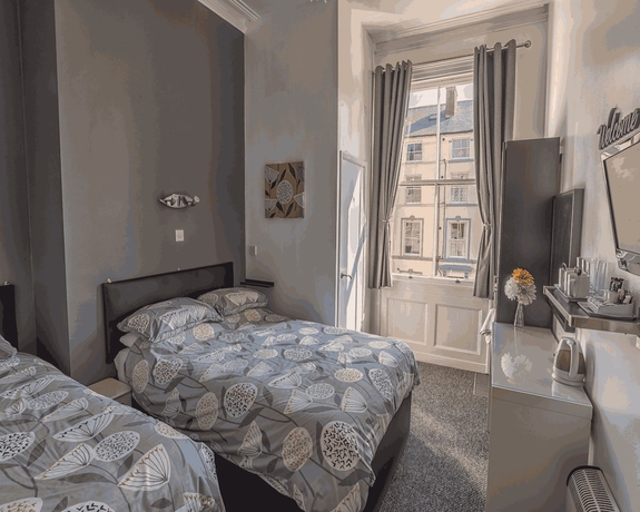 Imagen de la habitación del Hotel Miricia Guest House. Foto 3