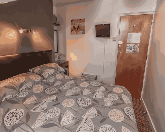 Imagen de la habitación del Hotel Miricia Guest House. Foto 15