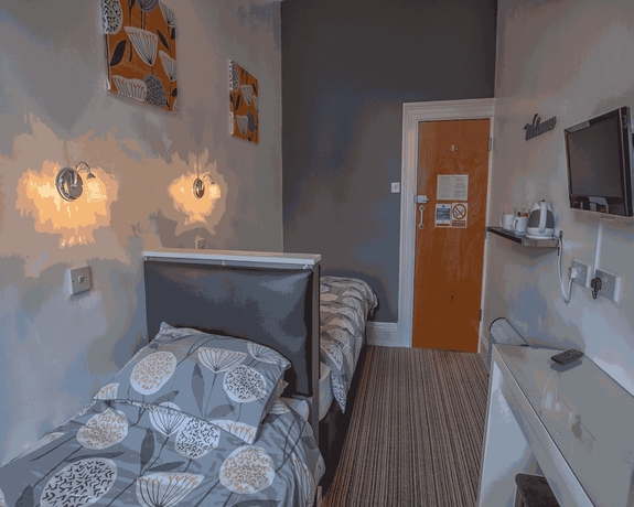 Imagen de la habitación del Hotel Miricia Guest House. Foto 16