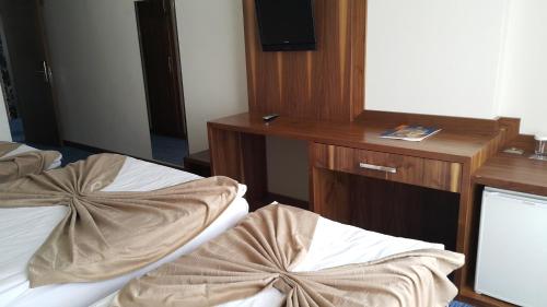 Imagen de la habitación del Hotel Miroglu, Yenişehir. Foto 8