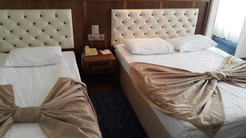 Imagen de la habitación del Hotel Miroglu, Yenişehir. Foto 9