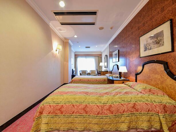 Imagen de la habitación del Hotel Mission Hills Geihinkan. Foto 18