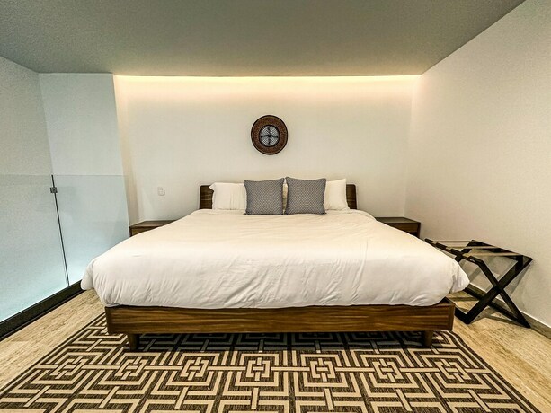 Imagen de la habitación del Hotel Mistiq Gardens. Foto 18