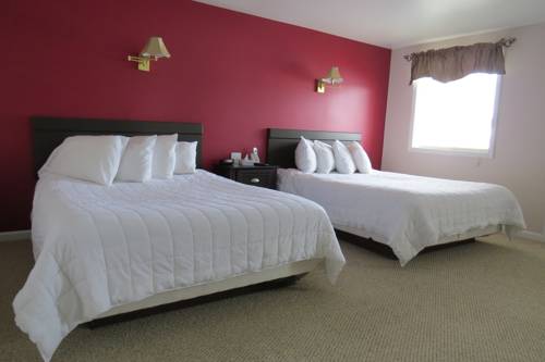 Imagen de la habitación del Hotel Misty Harbor Barefoot Beach Resort. Foto 10