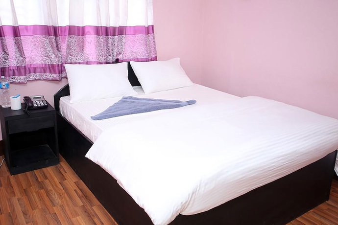 Imagen de la habitación del Hotel Mitra garden Inn. Foto 11
