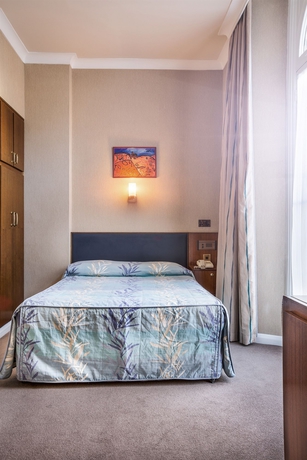 Imagen de la habitación del Hotel Mitre House. Foto 10