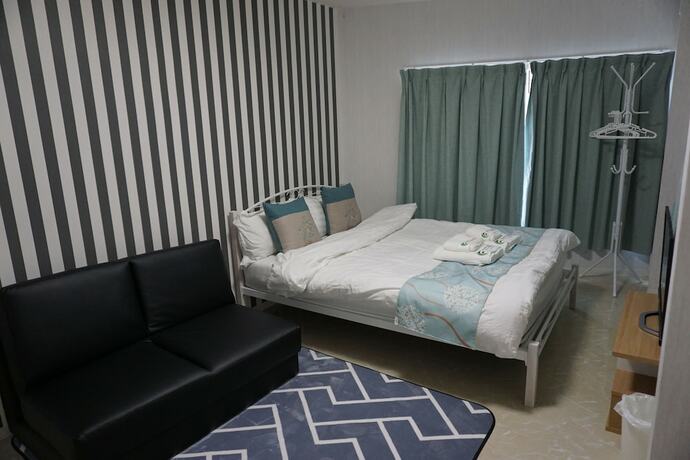 Imagen de la habitación del Hotel Mitsuba. Foto 14