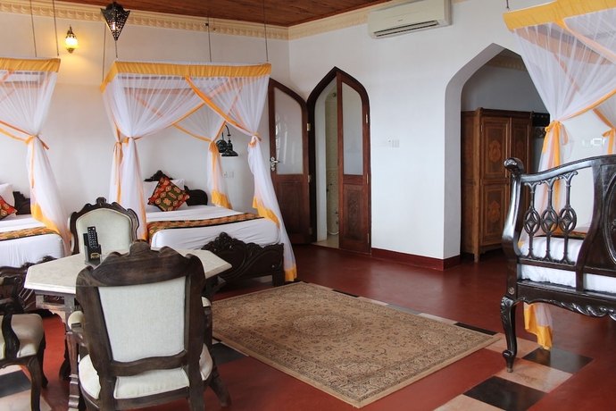 Imagen de la habitación del Hotel Mizingani Seafront. Foto 16