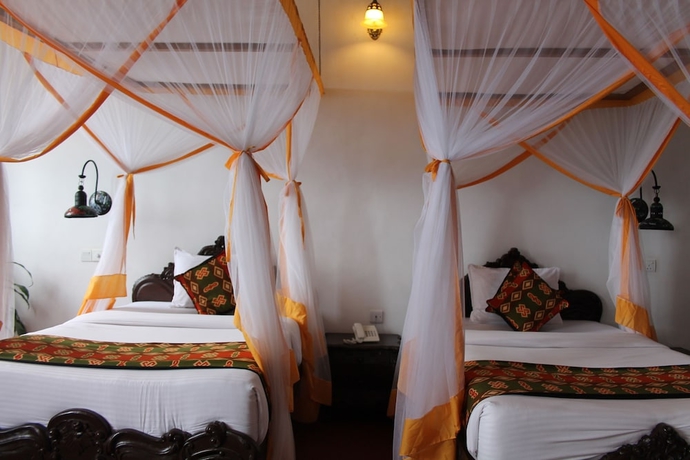 Imagen de la habitación del Hotel Mizingani Seafront. Foto 17