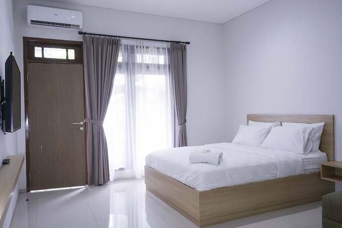 Imagen de la habitación del Hotel Mk House Tendean. Foto 17