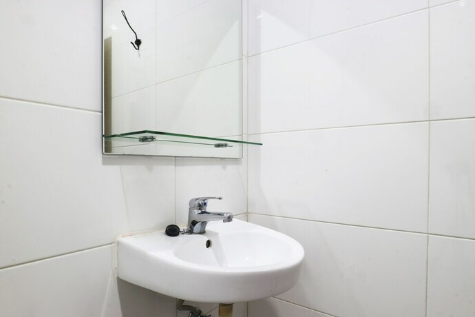 Imagen de la habitación del Hotel Mk House Tendean. Foto 25