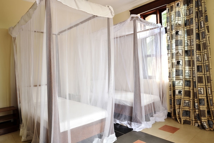 Imagen de la habitación del Hotel Mnarani Beach Cottages. Foto 5