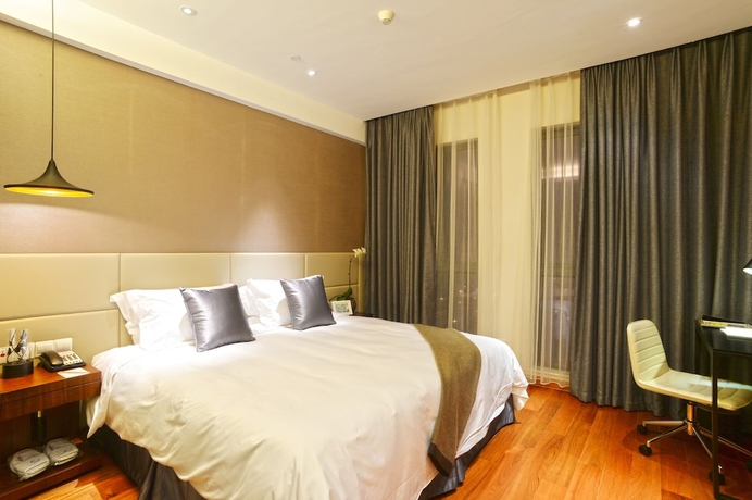 Imagen de la habitación del Hotel Modena By Fraser New District Wuxi. Foto 14