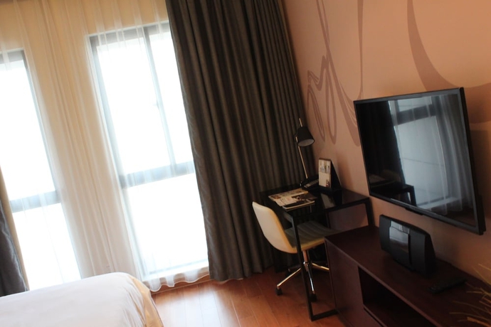 Imagen de la habitación del Hotel Modena By Fraser New District Wuxi. Foto 18