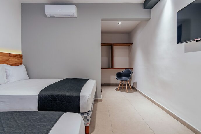 Imagen de la habitación del Hotel Mody Merida. Foto 17